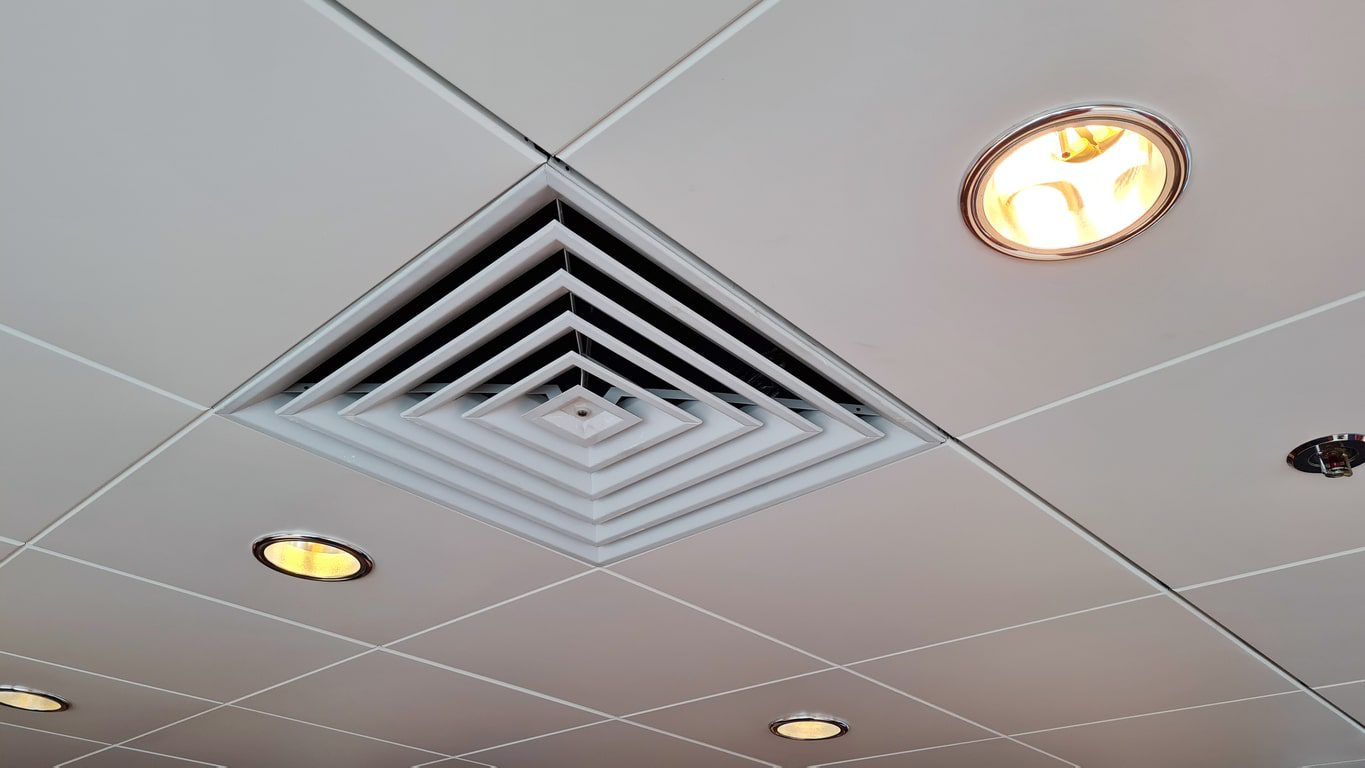 An air duct hanging from a ceiling, close-up, low angle view